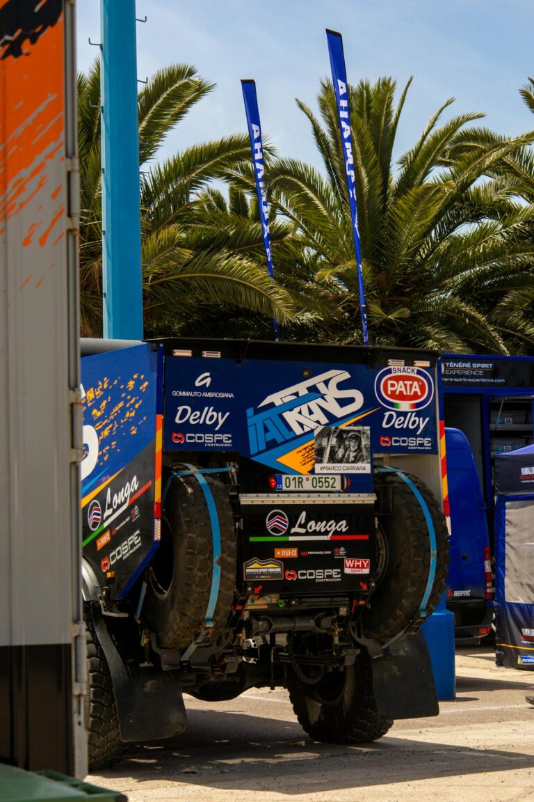 Rugged rally truck equipped for off-road challenges, parked outdoors.